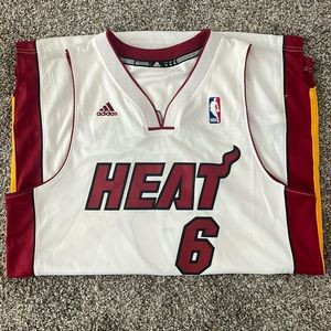 Used Men’s Adidas Lebron James Miami Heat white jersey. Size M men’s.